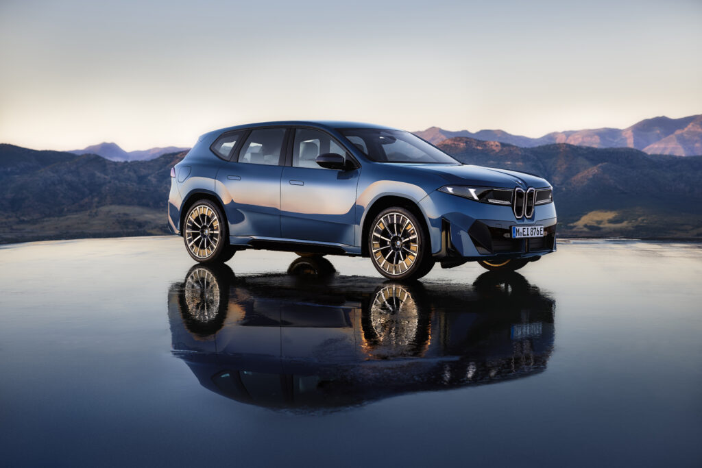 2026 BMW iX3 electric SUV in front three-quarter view with modern design and LED headlights.