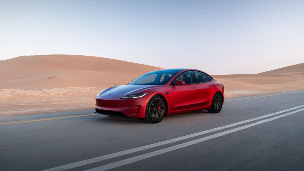 "2026 Tesla Model 3 featuring a sleek all-electric sedan design with aerodynamic styling, LED headlights, minimalist exterior, premium alloy wheels, and a modern performance-focused appearance."