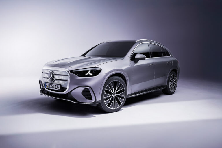 2027 Mercedes-Benz GLC parked on a scenic modern city street featuring sleek LED headlights, sporty front grille, premium alloy wheels, and elegant luxury SUV styling.