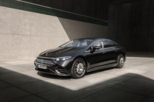2027 Mercedes-Benz EQS electric luxury sedan showcasing futuristic aerodynamic design and LED lighting