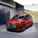 2027 Mercedes-Benz VLE luxury electric van parked in a modern urban setting with futuristic LED lighting, sleek aerodynamic design, large alloy wheels, and premium executive styling.