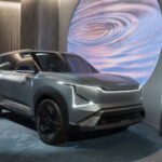 2027 Kia EV5 compact electric SUV with modern futuristic design and LED lighting in a studio setting