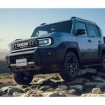 2027 Toyota Land Cruiser FJ on mountain terrain, a display of rugged design and off-road capability.